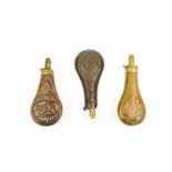 Three 19th Century Copper Powder Flasks:- one by Sykes, each side embossed with a flute bordered