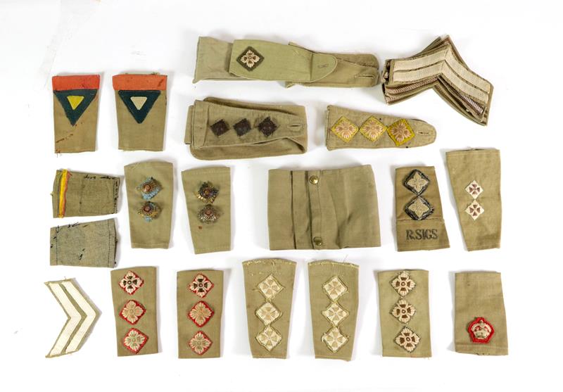 A Small Quantity of Mainly Second World War British Army Khaki Drill Insignia, including rank