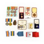 A First/Second World War Group of Family Medals and Badges, comprising a British War Medal and