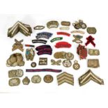 A Quantity of Mainly Second World War British Army Insignia, including rank and trade badges, and