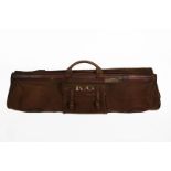 An Early 20th Century Military Officer's Suit Carrier, in brown canvas trimmed with crushed leather,