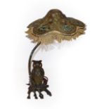 An Austrian bronze owl table lamp and shade, the owl's glass eyes flicker when the switch is