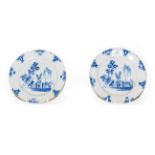 A pair of 18th century English Delft blue and white pancake plates painted with chinoiserie