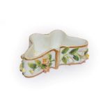 A Rockingham Porcelain 'Butterfly' box (lacking cover), decorated with applied Dresden flowers,