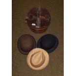 A gentleman's top hat in leather case, two bowler hats and another. Bowler hats one marked for