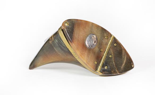 A George III Brass-Mounted Cow Horn Snuff-Box, irregularly shaped, the plain rim engraved 'D.A.