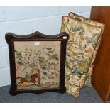 Two decorative embroidered rectangular cushions and a woolwork embroidery of a huntsman in a