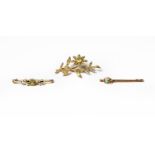 A peridot and split pearl brooch, the floral spray set throughout with two round cut peridots and