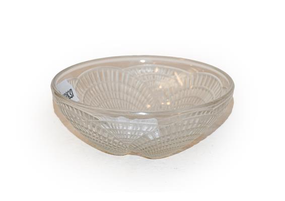 A Lalique bowl, Coquilles, 13cm diameter. Signature R Lalique. moulded. In good condition