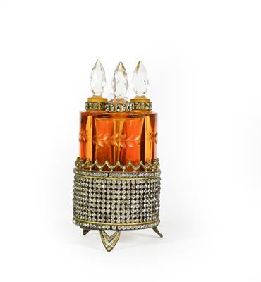 A set of Four Amber Glass Scent-Bottles, each fitting into the circular paste set stand, total