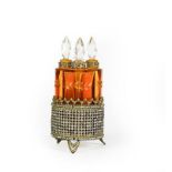A set of Four Amber Glass Scent-Bottles, each fitting into the circular paste set stand, total