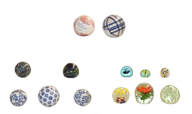 A group of 19th century French porcelain carpet boules, and 19th century and later paperweights