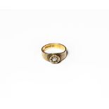 A 15 carat gold diamond solitaire ring, the old cut diamond within a yellow star setting to a
