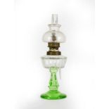 A Gilt-Metal Mounted Clear and Green Glass Scent-Bottle, in the form of an oil lamp, 18cm high