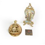 A French Brass and Enamel Thermometer, with easel-back, 17cm high; A brass paperweight, the base