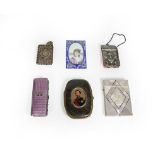 A collection of various metal mounted cases, including: one with a portrait of Napoleon III on the