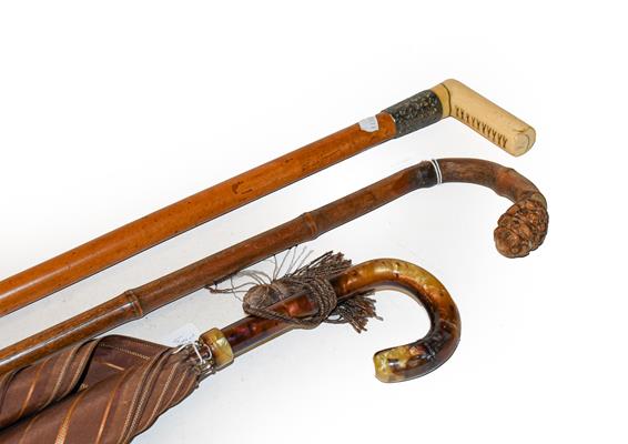 A 1920s Fox & Co Foxette parasol, 19th century ivory handled cane, bamboo walking stick and a
