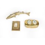 Two brass or brass finish snuff-boxes and an articulated fish ornament, the snuff-boxes each