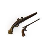 A Continental flintlock pistol and a rimfire target pistol.