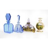 Three Glass Scent-Bottles, two in blue, the third amethyst glass and with 'gem'-set gilt-metal