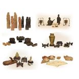 Two trays of Chinese and Japanese artifacts including soapstone carvings, one formed as a hen, a