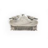 A White Metal Moustache Comb, Possibly Indian, with two exotic bird finials, with compartment for