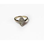 A diamond cluster ring, the navette shaped cluster set throughout with round brilliant cut diamonds,