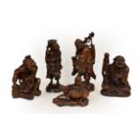 Five late 19th/early 20th century Chinese hardwood carvings, a fisherman, a nomad, water buffalo and