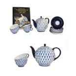 A Lomonosov porcelain Cobalt Net pattern part tea set (seconds), and a book Lomonosov porcelain