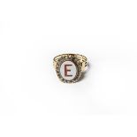 An intaglio ring, initialled 'E' within a rose cut diamond border, finger size Q. Gross weight 5.0