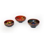 Three Walter Moorcroft Flambe small bowls, Hibiscus, Pansy and Clematis . In good condition