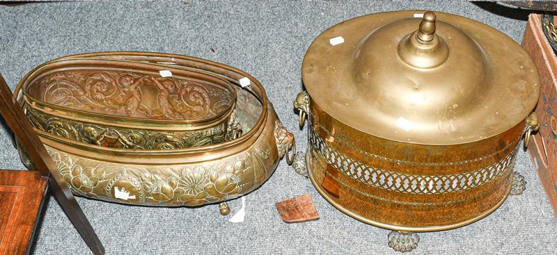 A 19th century brass twin-handled coal bucket, with pierced body raised on four paw feet, together