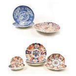 A pair of Japanese blue and white scalloped dishes, an Imari scalloped dish with seven other