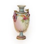 A Royal Worcester floral painted twin-handled vase, shape no - 1618, bearing puce marks, 23cm