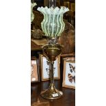 A Victorian brass oil lamp with a vaseline shade, 66cm overall including funnel. Few fleabite