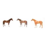 Beswick Large Racehorse, model No. 1564, palomino gloss and a brown gloss example; together with a