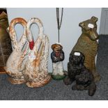A pair of Victorian cast iron swan door stops, two other door stops in the form of dogs, and a