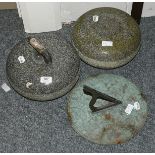 Two curling stones (one handle lacking), together with a sundial (3)