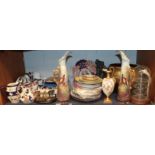 A shelf of decorative ceramics including a Royal Worcester ewer, pair of Royal Doulton figures -