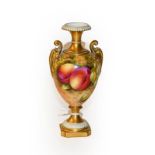 A Royal Worcester pedestal vase by Edward Townsend, with scrolling handles, painted with peaches and