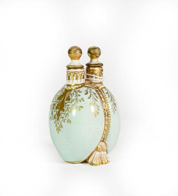 A Ceramic Double Scent-Bottle, each side bombe and on shell feet, the sides gilt heightened on light