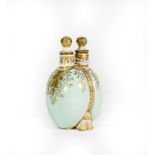 A Ceramic Double Scent-Bottle, each side bombe and on shell feet, the sides gilt heightened on light