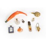 A Collection of Various Silver or Metal-Mounted Scent-Bottles, including: a ceramic example in the