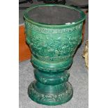 An early 20th century Chinese green glazed jardiniere on stand decorated with dragons, 45cm diameter