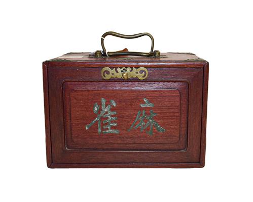 A cased bone Mahjong set. Size of the box 24cm by 17cm by 17cm. The box a little tired, the back