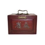 A cased bone Mahjong set. Size of the box 24cm by 17cm by 17cm. The box a little tired, the back