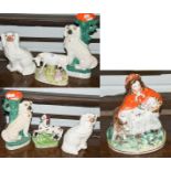 A group of 19th century Staffordshire figures including two pairs of Spaniels, prancing horse, cow