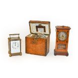 A pigeon timing clock, compass, Art Nouveau mantel timepiece, and a brass carriage timepiece