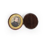 Continental School, an oval portrait miniature on ivory of a young gentleman in black coat, in brass