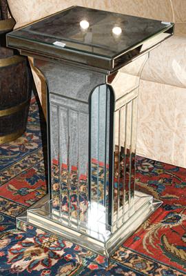 A mirrored pedestal, 41cm square by 77cm